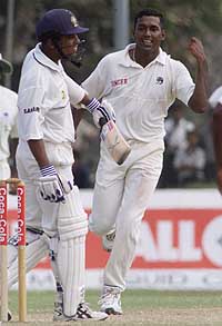 Sri Lankan bowler Ruchira Perera (R) celebrates the wicket of Indian batsman Shiv Sunder Das.