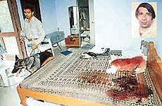 The blood-soaked bedsheet on which Satwant Singh Gill (inset) was found murdered in a room of the Gill estate in Kansal village on Friday.