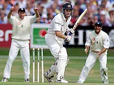 England's Mike Atherton (L) celebrates as Australia's left handed batsman Simon Katich is bowled out by Darren Gough for 15 during the Ashes fourth test at Headingley, Leeds on Friday.