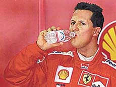 Germanys Ferrari driver Michael Schumacher takes refreshment during the first free practice session at the Hungaroring racetrack near Budapest on Friday. 
