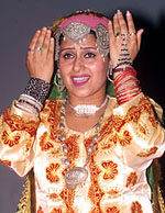 Kashmiri artistes wearing traditional attire.