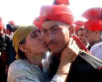 A Kashmiri woman hugging her son after a passing out parade of 140 newly recruits