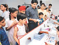 Students of Manav Mangal School, Sector 21, Chandigarh, explain the functioning of the Postal Department at an annual exhibition on Sunday. 