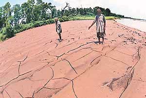 VICTIM OF NATURES FURY: This piece of land ravaged by devastating waters of the Ghaggar has been rendered barren. This photograph was taken by Tribune lensman Karam Singh near Banur on Sunday.