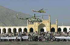 Helicopters of Afghanistans ruling Taliban fly over during a military parade.