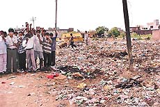 Garbage along the railway line near Kartar Nagar makes life of the residents miserable.