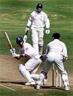 England's captain Nasser Hussain watches the ball fall into the hands of Australian wicket keeper.