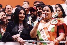 Bollywood actress Pooja Bhatt with Indian pop singer Usha Uthup at 'India Day Parade-2001' in New York on Sunday. 