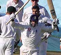 Mark Butcher runs off the field as England defeated Australia in the fourth Ashes Test at Headingly, Leeds, on Monday.