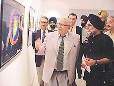 Punjab Governor Lieut-Gen J.F.R. Jacob goes round the exhibition of Shiv Singhs paintings in Chandigarh on Wednesday.