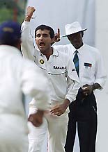 Indian skipper Sourav Ganguly (R) celebrates the wicket of Sri Lankan batsman Suresh Perera during the first day of their second Test in Kandy on Wednesday. 