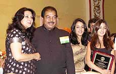 Bollywood actress Moon moon Sen and her two daughters Riya Sen and Rima Sen with Albert Jasani, Vice President of Federation of Indian Association of New York at a gala banquet hosted by FIA on the occasion of 54th India's Independence Day celebrations in New Jersey.