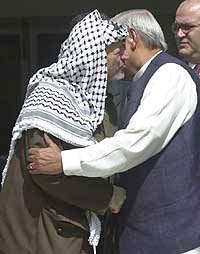 Prime Minister Atal Behari Vajpayee hugging Palestinian President Yasser Arafat in New Delhi on Thursday.