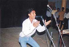A student of SCD Government College presents histrionics as he competes in the talent hunt contest held in Ludhiana on Thursday.