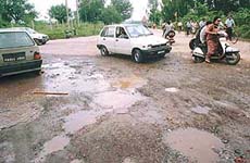 There is nothing you can do to avoid potholes, but you can be gentle on the car. Photo: Parvesh Chauhan