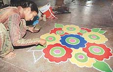 A student participates in the inter-house rangoli competition at Dev Samaj College for Education, Sector 36, Chandigarh, on Saturday.