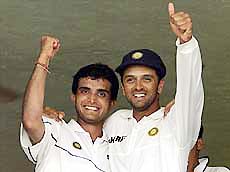 Indian captain Saurav Ganguly (L) and teammate Rahul Dravid celebrate after beating Sri Lankan by seven wickets.