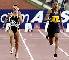 American Marion Jones (right) edges ahead of Ukraines Zhanna Pintusevich -Block to take first place in the womens 100 meter at the Memorial Van Damme athletics event at Brussels King Baudouin Stadium on Friday. 