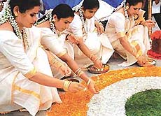 Members of the Chandigarh Malayalee Association prepare Athapukalam on the occasion of Onam in Chandigarh on Sunday.