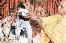 A devotee performs mahabhishek of Sri Radha Madhav on the occasion of Radhashtami at ISKCON, Sector 36, Chandigarh, on Sunday.