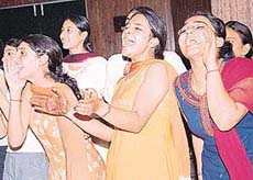 THREE CHEERS: Students of Home Science College, Sector 10, cheer up a colleague who is on the stage during a talent hunt show in Chandigarh on Monday. 