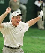 Jim Furyk (USA) reacts as his bunker shot on the 18th green dropped in for a par in the first playoff hole in the final round of the NEC Invitational at the Firestone Country Club on Sunday. 