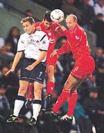 Liverpools Gary McAllister (R) and Markus Babbel(C) clash in the air with Boltons Bo Hansen during the premiership match between Bolton Wanderers and Liverpool at the Reebok Stadium on Monday.