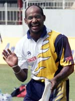 Sri Lankan captain Sanath Jayasuriya smiles during a practice session at Sinhalese Sports Club grounds in Colombo on Tuesday.