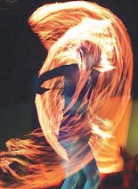 An African fire dancer performs during the opening ceremony of the Goodwill Games in Brisbane on Tuesday.