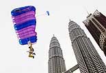 American Mark Lichtle parachutes down from the world's tallest buildings, the Petronas Twin Towers, during a practice ahead of the Malaysia International Extreme Skydiving Championship in Kuala Lumpur on Tuesday.