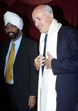Ranbir Singh Guri, Chairman of British Asian Conservative Link, left, stands next to opposition Conservative Party leadership contender Iain Duncan Smith, right, in London on Monday. 