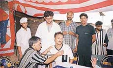 A patient being examined at a monthly camp held at a factory in Kohara.