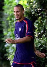 England and Leeds United's defender Rio Ferdinand smiles as he arrives for a training session at Bisham Abbey National Sports Centre on Wednesday.