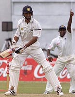 Sri Lankan captain Sanath Jayasuriya appeals unsuccessfully for a leg before wicket decision against Hemang Badani .