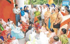 BJP-SAD members protest against the Mayor, Ms Harjinder Kaur, for removing the portraits of national heroes from her office on Thursday, at Sector 17 in Chandigarh on Friday. 