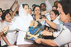 The Mayor, Ms Harjinder Kaur, asks Congress workers to leave her room after they forced their entry into the office to demand installation of Indira Gandhi's picture, in Chandigarh on Friday.