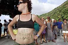 Christmas Islander Lin Gaff shows her opinion on the plight of hundreds of asylum-seeking refugees currently being held by Australian soldiers on a Norwegian freighter off the coast on Friday.