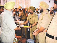 DGP Sarabjit Singh distributes pagers to police personnel