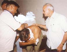 Mr Brij Lal Rinwa, Punjab BJP president, examining the injuries suffered by BJP municipal councillor Krishan Kumar Garg