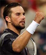 Pat Rafter of Australia celebrates victory over Nicolas Lapentti