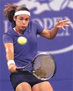 Virginia Ruano Pascual of Spain returns a shot to Jennifer Capriati