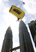 Australian base jumper Jimmy Freeman parachutes from the world's tallest building, Petronas Twin Towers, during the Malaysia International Extreme Skydiving Championship in Kuala Lumpur on Sunday.