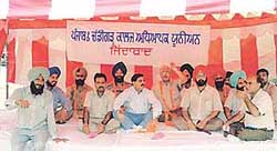 Members of the PCCTU on relay fast in Ludhiana on Monday.