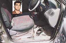 Pieces of glass scattered on the drivers seat bear testimony to the brutal murder of Pankaj Rana 