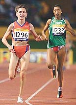 Current world champion Olga Yegorova (L) from Russia crosses the line ahead of Berhane Adere from Ethiopia to win the 5000 metres race during the Goodwill Games in Brisbane on Tuesday. 