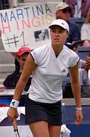Martina Hingis of Switzerland prepares to begin play against Daja Bedanova.