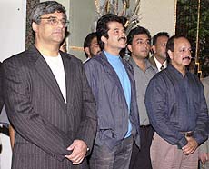 Bollywood star Anil Kapoor watching clippings of his new film 'Nayak.'