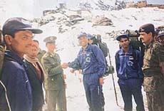 Major Jaspreet Singh interacts with a Chinese Army officer at a high-altitude forward base.
