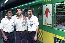 Actors sing while taking part in an "anti-suicide" play in an underground metro station.