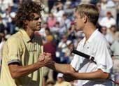 Gustavo Kuerten (left) of Brazil shakes hands with Yevgeny Kafelnikov